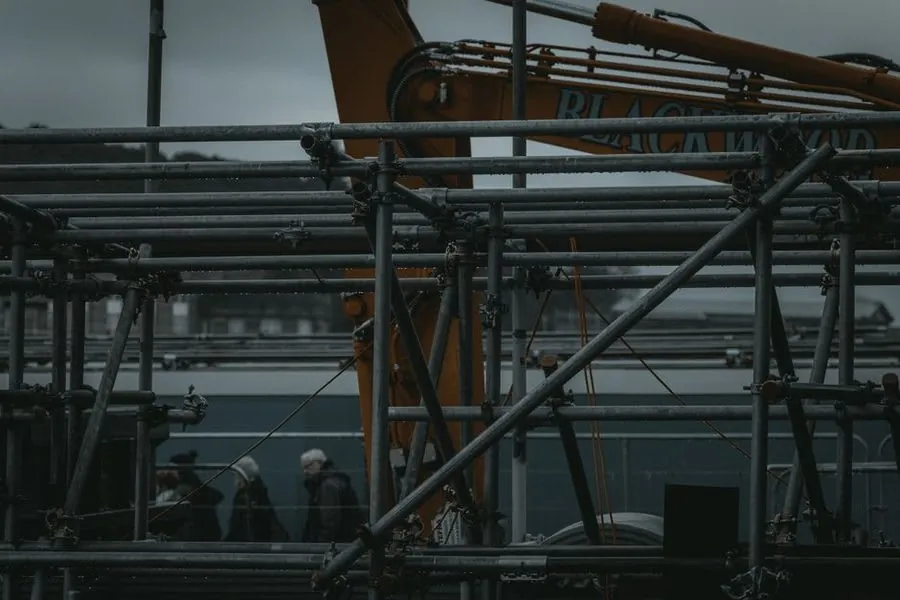 Scaffolding set up around a house for roofing work in the UK