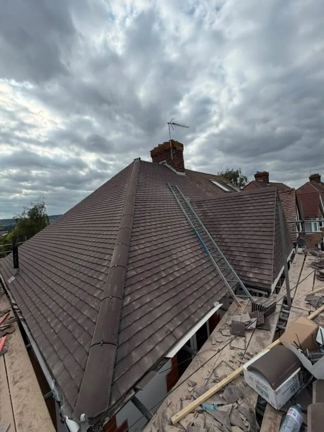 Newly tiled hipped roof completed by N Fullers in Sussex